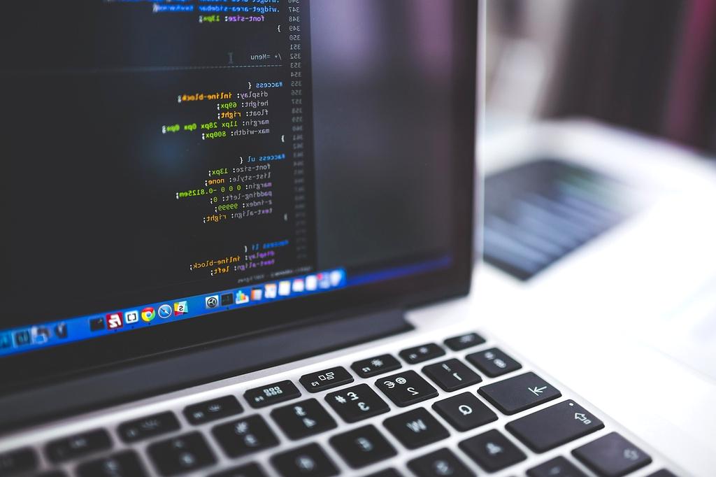 Children learning to code in a classroom environment